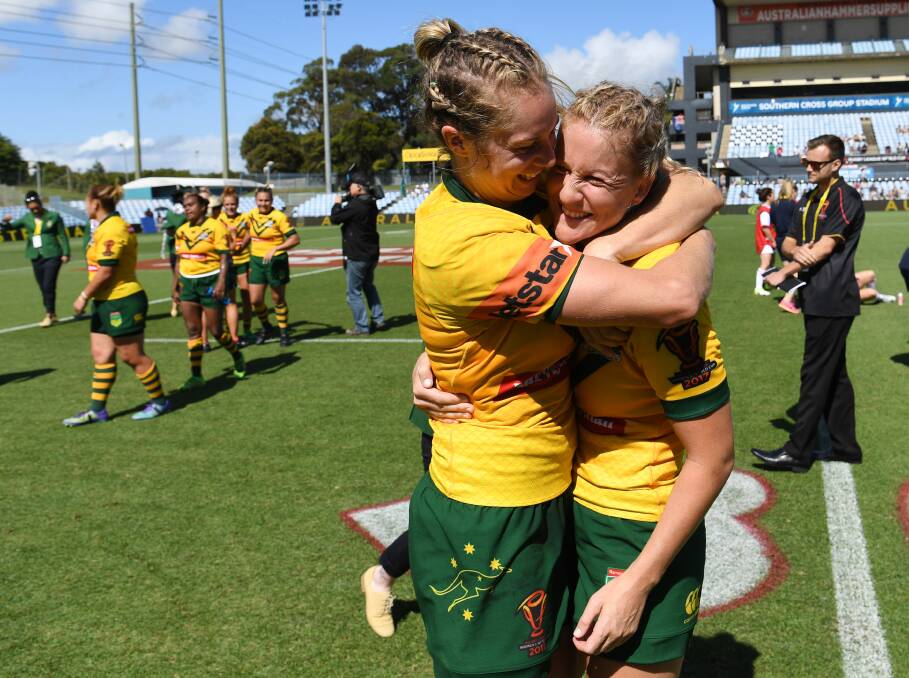 Jillaroo team mates Kezie Apps and Talesha Quinn from Parkes celebrate their first World Cup win over the Cook Islands on November 16. Photo: NRL Photos