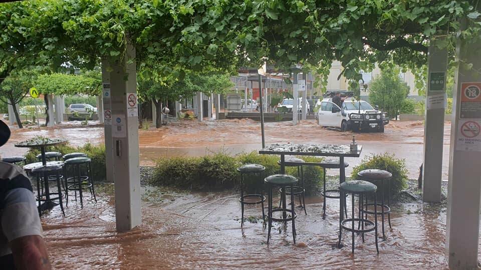 MAIN STREET: The sight of Clarinda Street, opposite the Coles carpark, during the flash flooding caused by a storm supercell on Saturday afternoon. Some areas had 50mm-80mm of rain in 20 minutes. Photo: Jas McGuire