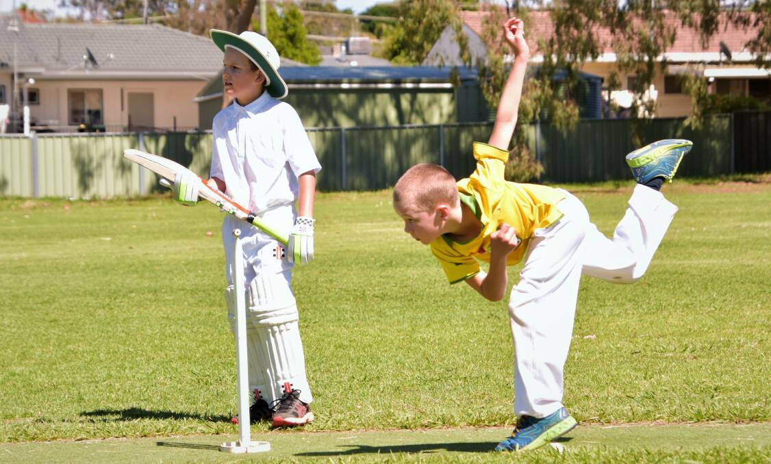 STRONG ARM: Under 10s bowler Sam Morgan sends the ball flying down the pitch, witnessed by batsman Jett Clark. Photo: Jenny Kingham