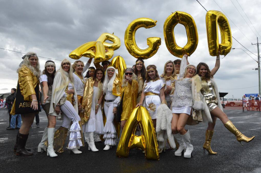 GOLD: A group of 50 women from Newcastle and the Central Coast headed west on the weekend, dressed spectacularly as ABBA Gold. Photo: Christine Speelman