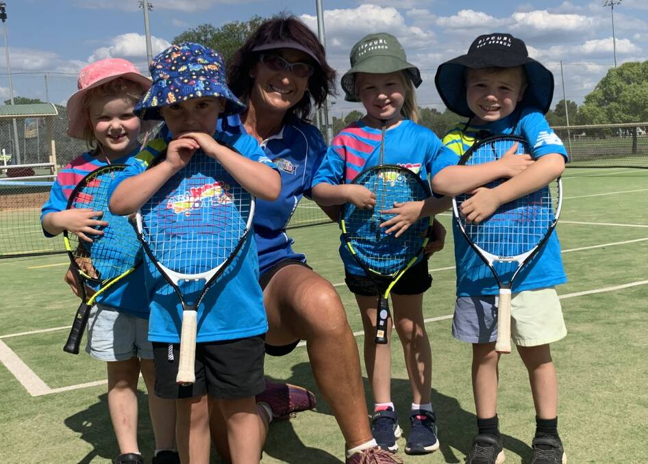 THE NEXT GENERATION: This gorgeous HotShots group are all second generation tennis players - Charli Townsend, Travis Hodges, Abby and Caleb Lovell with coach Helen Magill, have thoroughly enjoyed their first tennis experience as did their parents 20-plus years ago. Photo: Submitted