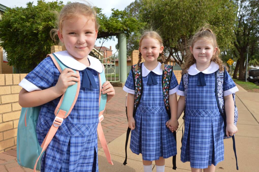 READY TO GO: Kindergarten students Sophie Doughty (5), Olivia Doering (4) and Tatum Lawler (5) of Parkes Public School can't wait to start big school on Monday. Photo: Christine Little