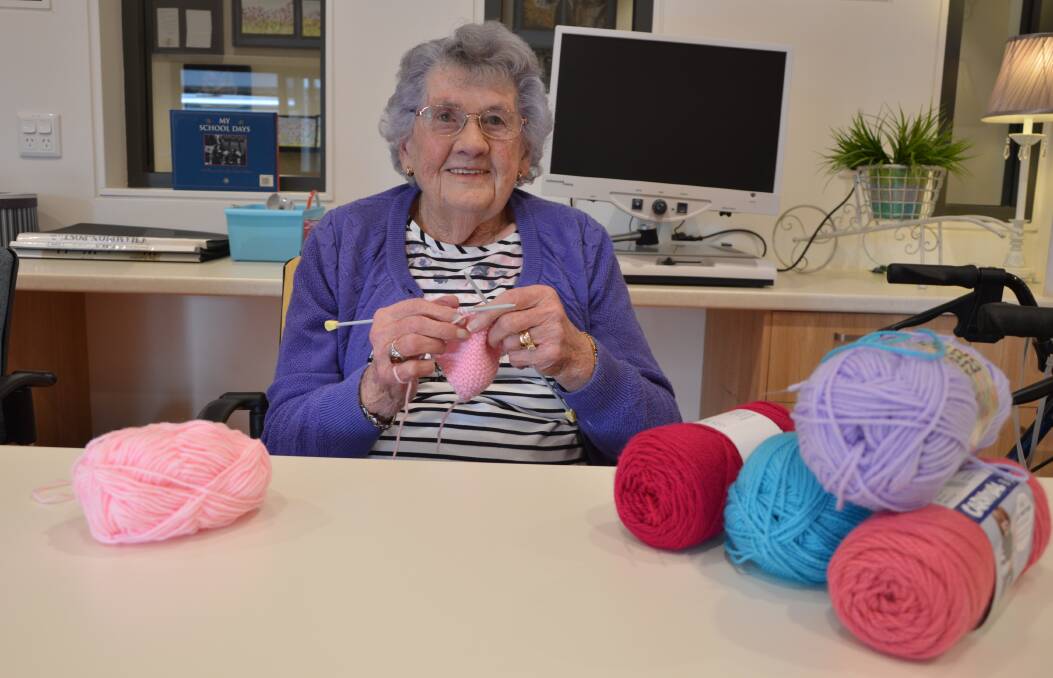 SQUARES FOR RUGS: 96-year-old Marie Davis knits squares to donate to Craft Corner, which are sent away to be made into rugs for those in need. Photo: Christine Little