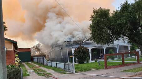 DEVASTATING: A newly renovated duplex in Dalton Street, opposite Parkes Cellars, was gutted by fire on Saturday morning. Photo: Parkes Fire and Rescue NSW