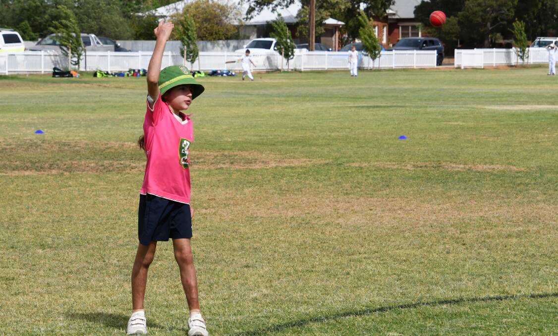 UNDER 10S: Olive Morgan did a great job fielding for the Parkes Crushers during an Under 10s match at Keast Oval. Photo: Jenny Kingham