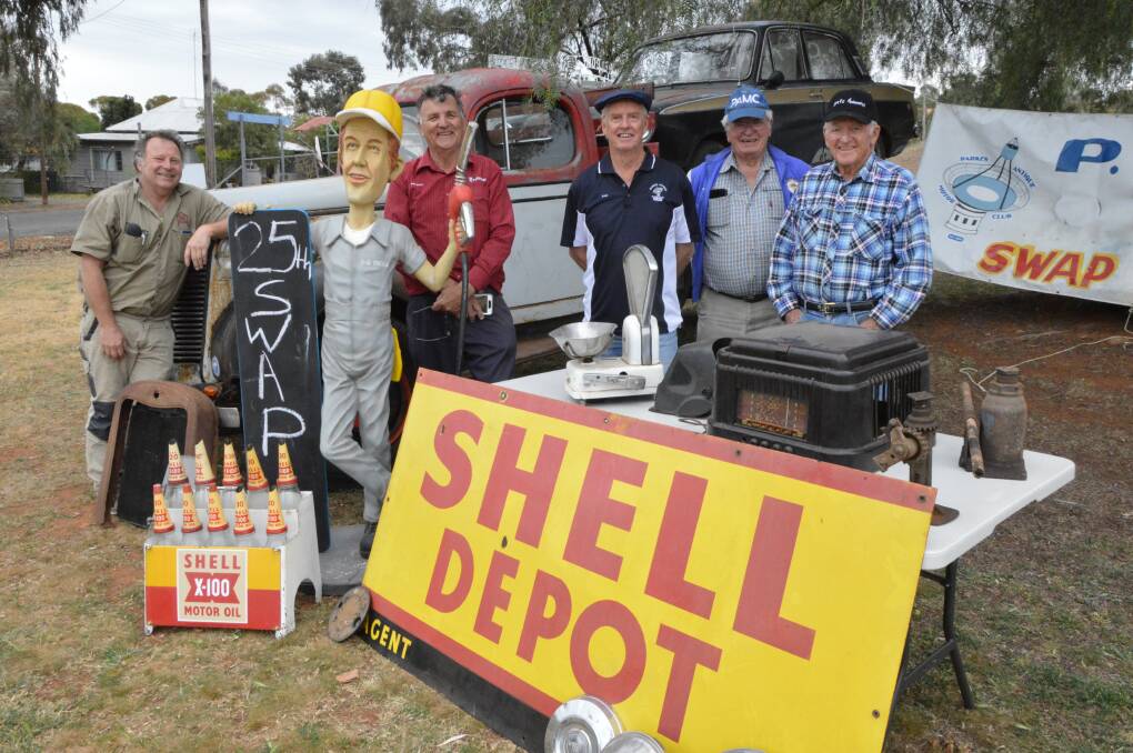 PLENTY ON SHOW: Central West Car Club president Rodney Barnes and Parkes Antique Motor Club members Phil Dixon, Alan Curteis, Barry Garment and Alan Payne with some historic motoring items. Photo: Christine Little