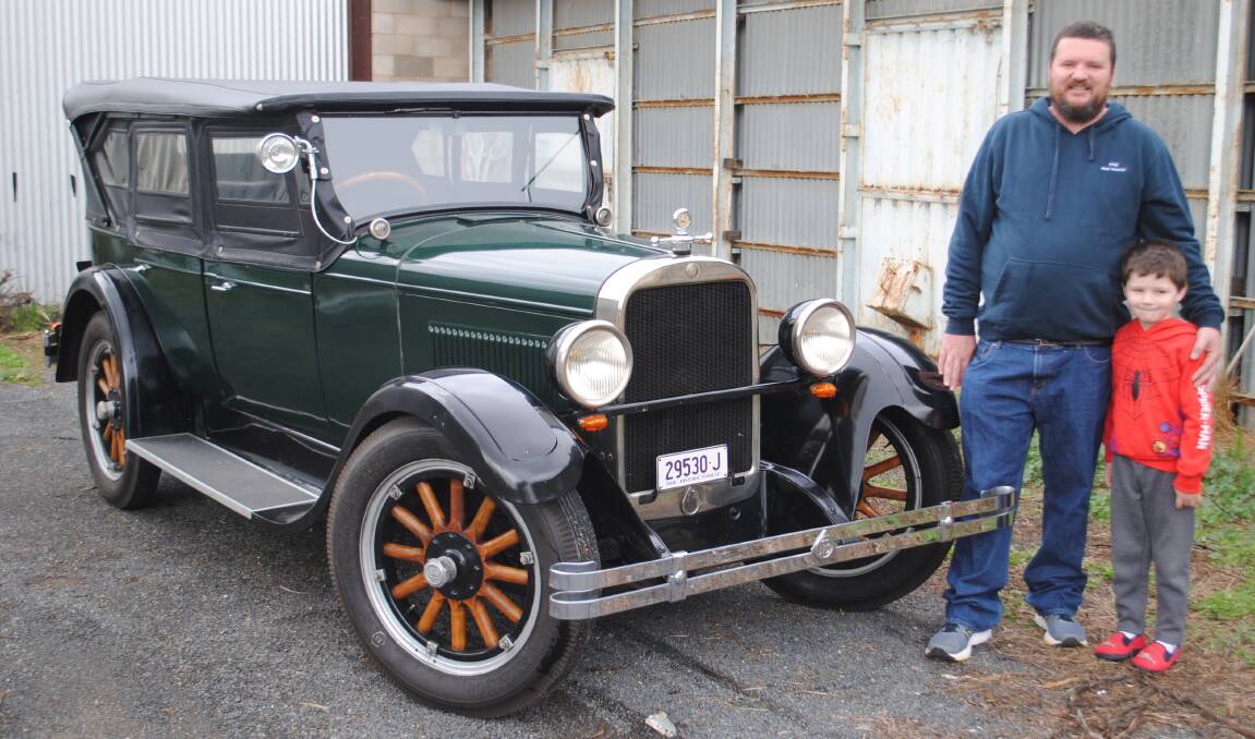 FATE: Brad Teague from Forbes, pictured with his son Nate, was meant to own this 1928 Dodge Fast Four sedan which belonged to his great grandfather and later sold to a new owner in 1965. Photo: Jeff McClurg
