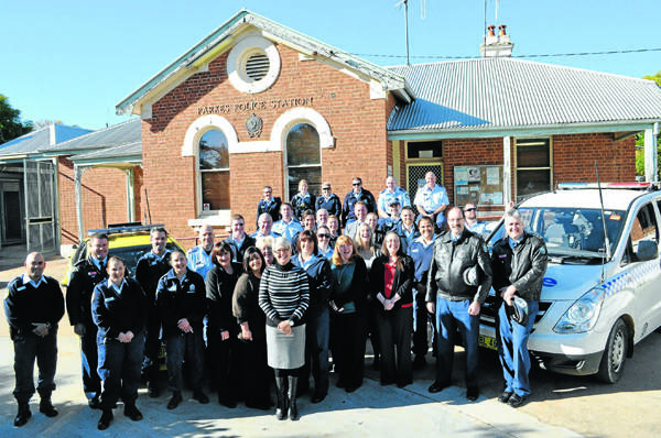Police and administration staff outside the Currajong Street Police Station on Wednesday prior to its total closure. Work on the new $14M Police Station in Court Street will get underway next month.  Photo: Bill Jayet   