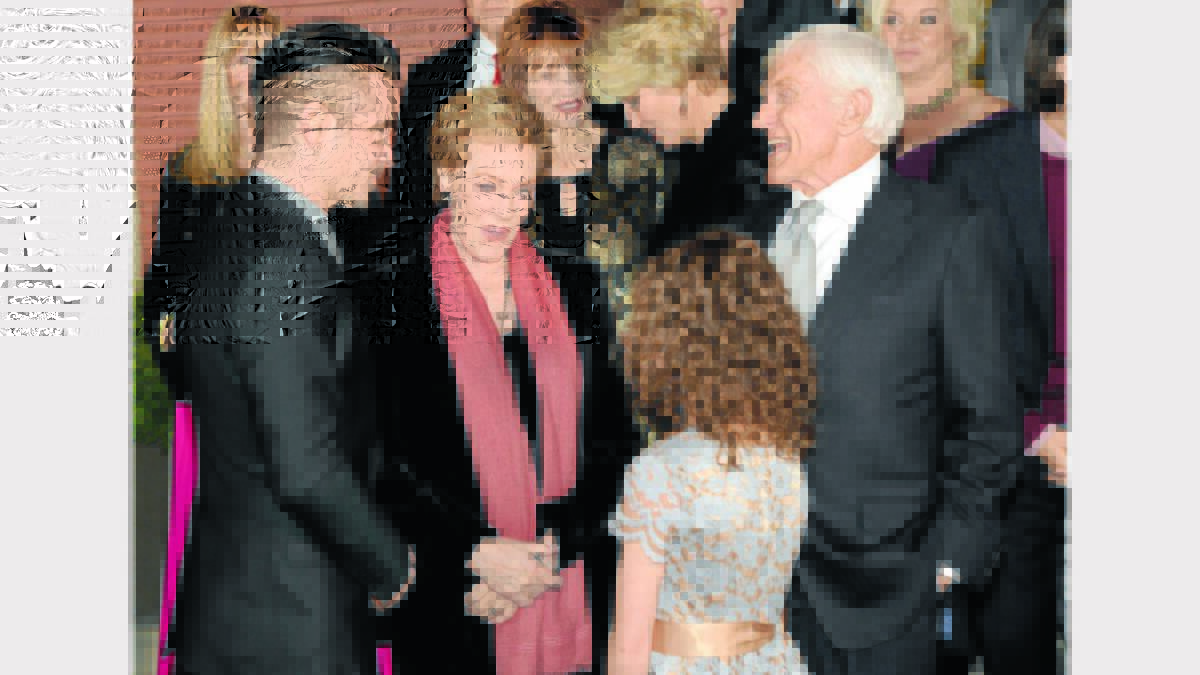 Colin Farrell introduces Annie to movie legends, Julie Andrews and Dick van Dyke.