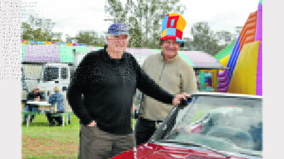Col Hawke from Parkes Car Club and Peak Hill Show’s ‘Roaming Commentator’ John Van der Reyden checked out the vintage car display.