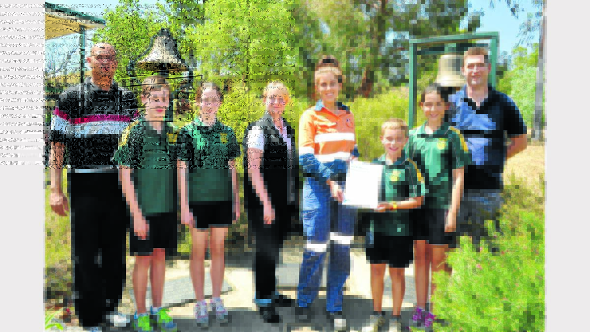 Pictured at Holy Family School with the grants are Mr Andrew Berger (Religious education coordinator), Andrew Finn and Charlotte Devlin (Vice Captains), Chrissie Clarke (Minerals Council Policy Manager, People in skills), Leisa Jensen (Northparkes Mine Health and Safety Adviser), William Searl and Evie Martin (School Captains), and Mr Chris Kupkee (Assistant Principal). Photos: Bill Jayet