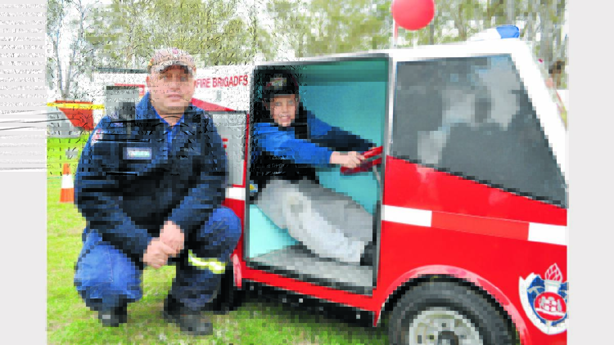 John Cantrall  (Fire and Rescue) supervised Ben Turner from Cumnock drive the toy fire truck.