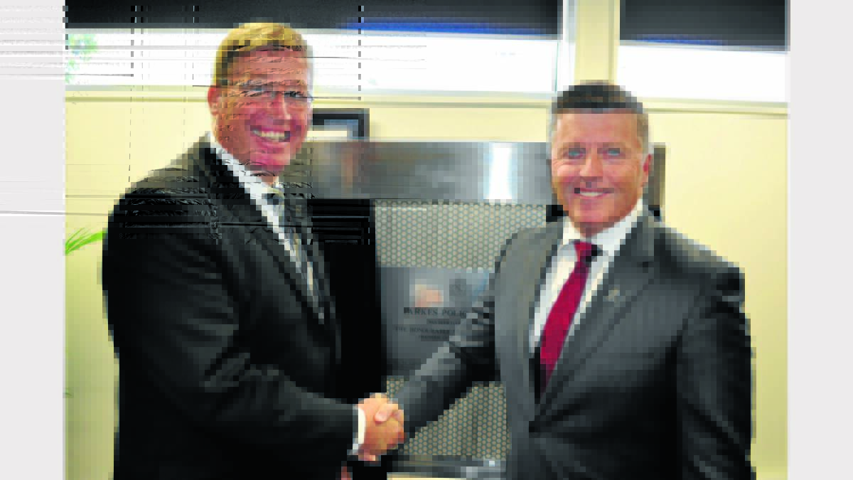 Local State Member for Dubbo, Troy Grant and Police Minister, Michael Gallacher after the plaque was unveiled yesterday to commemorate the official opening of the new Parkes Police Station. Photo: Bill Jayet.