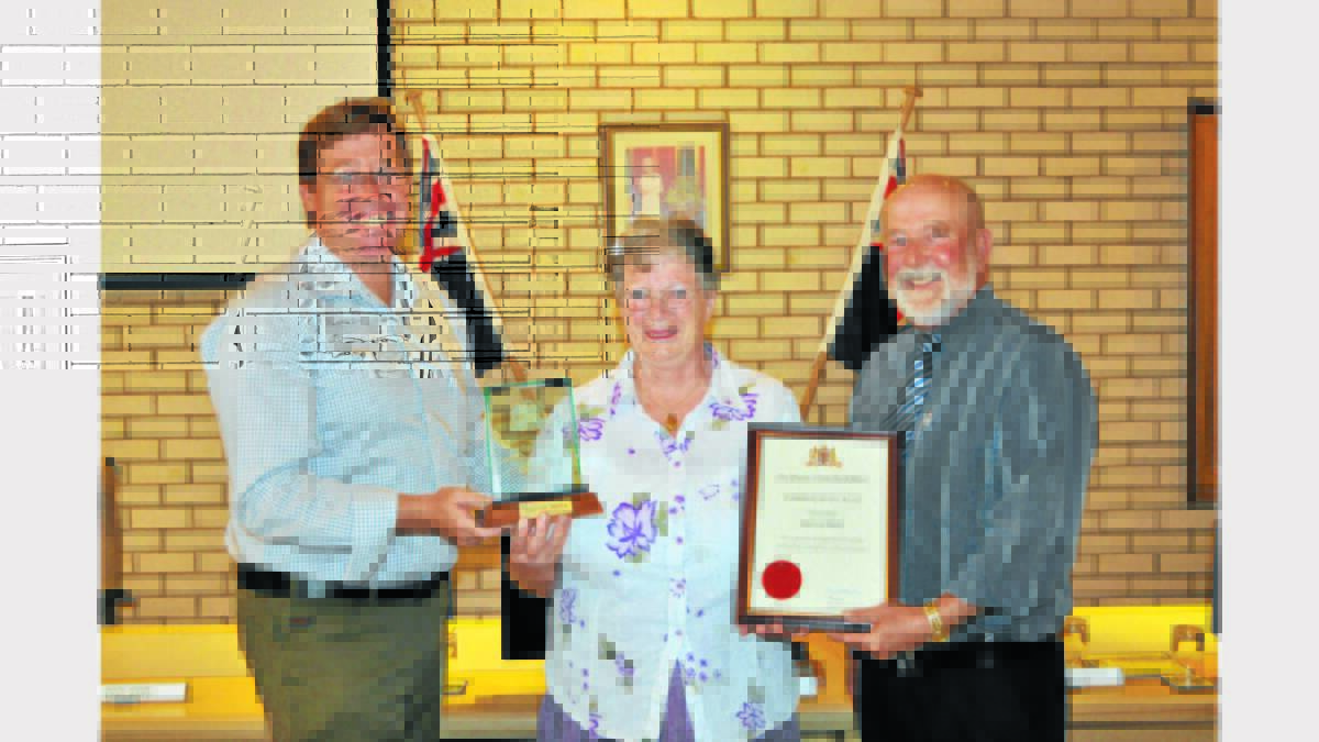 Pat Bailey received her NSW Community Service Award from local state MP, Troy Grant (left) and Parkes Mayor, Ken Keith. 