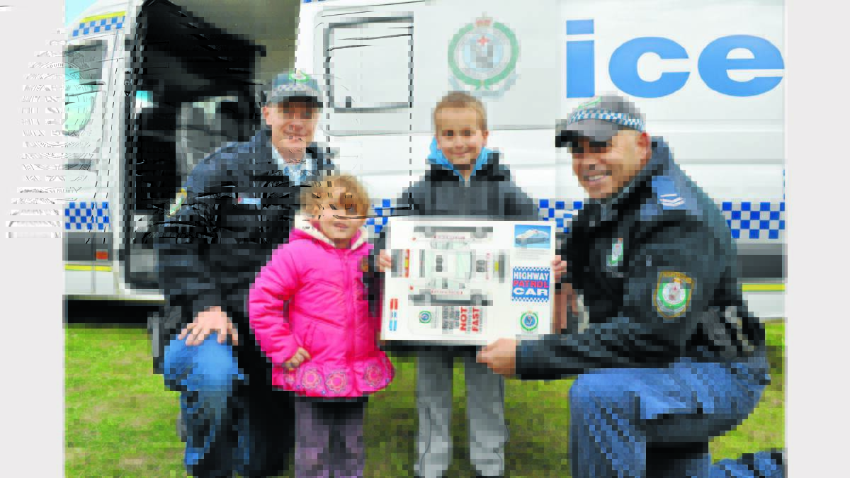 Senior Constable Daniel Greef (Crime Prevention Officer), and Senior Constable Wally Biles (Youth Liason Officer) showed Sharntelle Schnitger (3) and Goran Milinkovic (9) the Mobile Police Station.