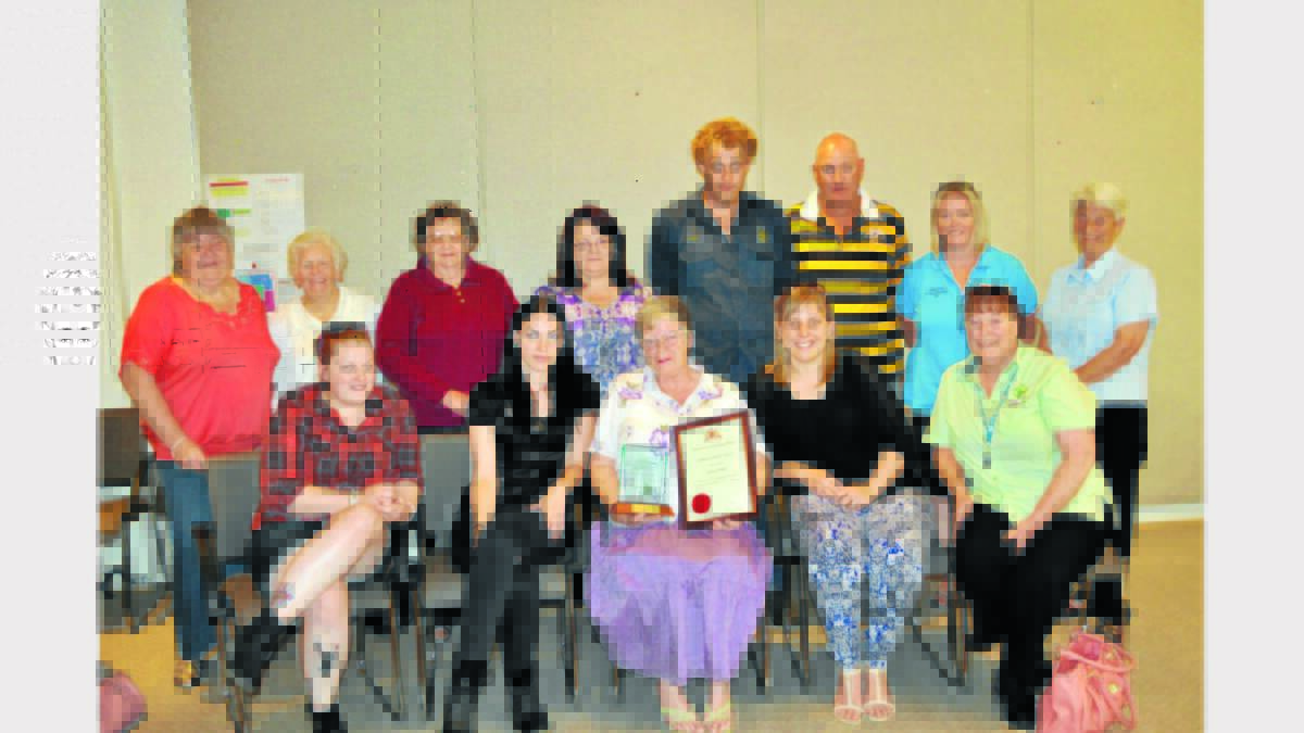 Award recipient, Pat Bailey, with family and friends after the presentation - back, Sandra Law, Dot Barkle, Ngaere Macdonald (past president, Can Assist), Narelle Schulze (Can Assist president), Aaron Bailey (grandson), Michael Bailey (son), Tanya Sinclair (daughter), Elaine Plicha; seated, Ashley Ryan (granddaughter), Kirstie Bailey (granddaughter), Pat Bailey, Kayla Webb (granddaughter) and Donna Ryan (daughter).   Photos: Roel ten Cate. 