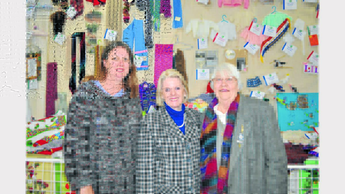 Locals Bernadette Aitken, Elizabeth Luke and Marcia Cross took in the various handicrafts on display.